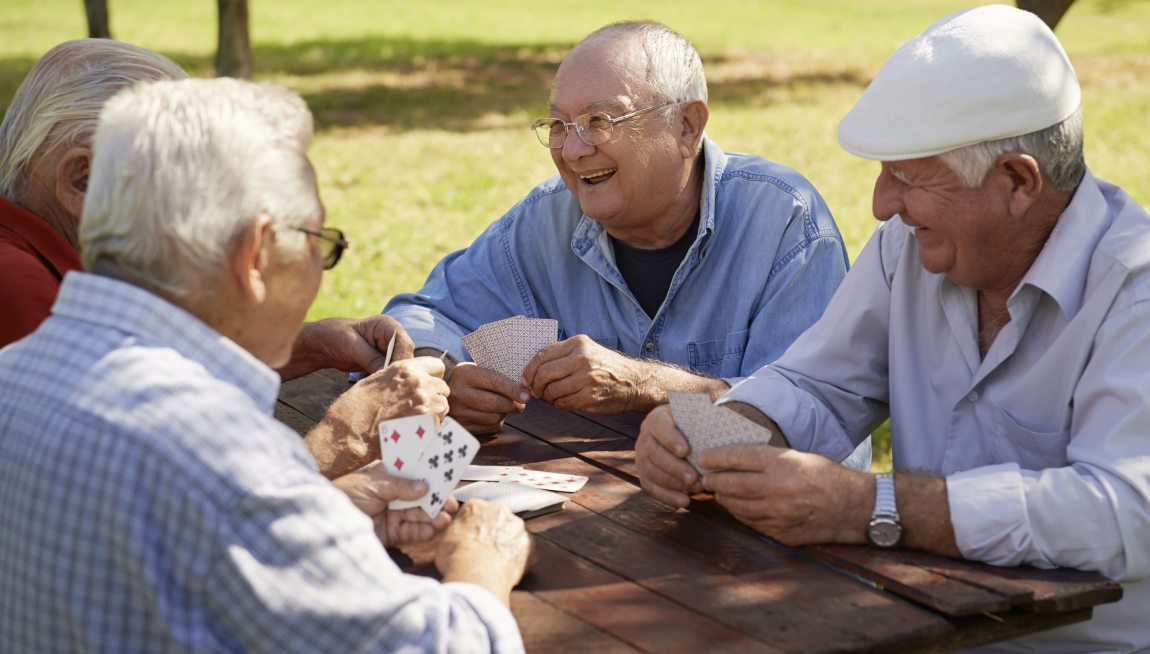 Group of elder men playing cards
