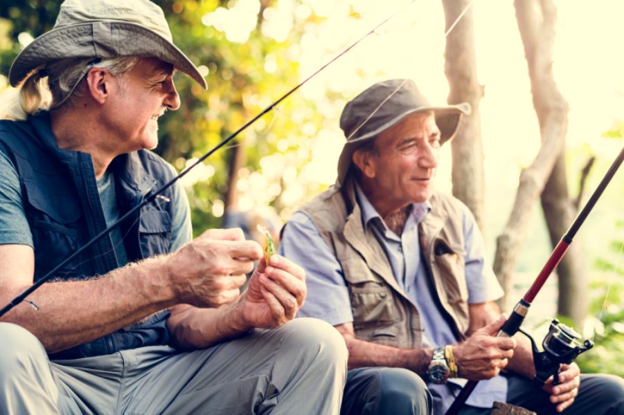 Two elderly friends fishing