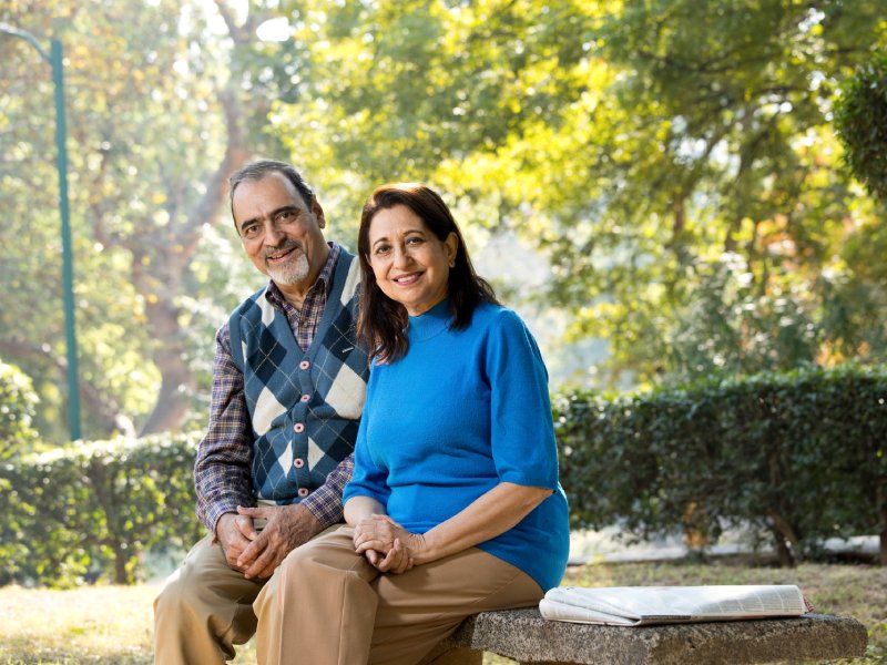 Portrait of senior couple smiling at park