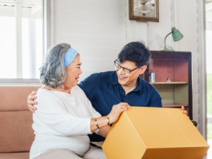 Senior asian mother and middle aged son sitting relax in living room on moving day, Happiness Asian family concepts